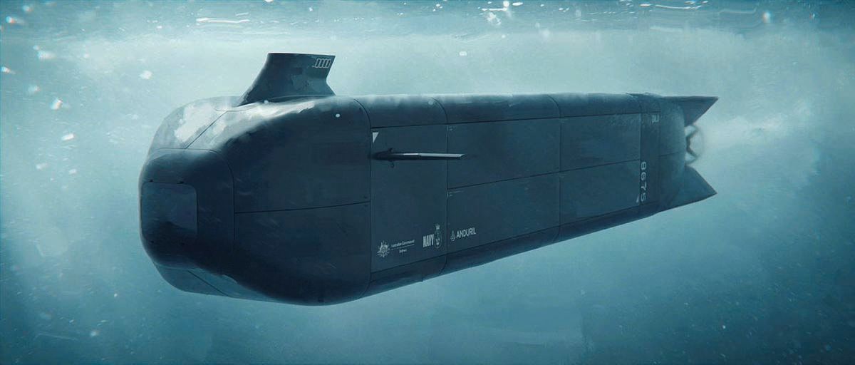 The hulking mass of the Ghost Shark submarine sits beneath the water.